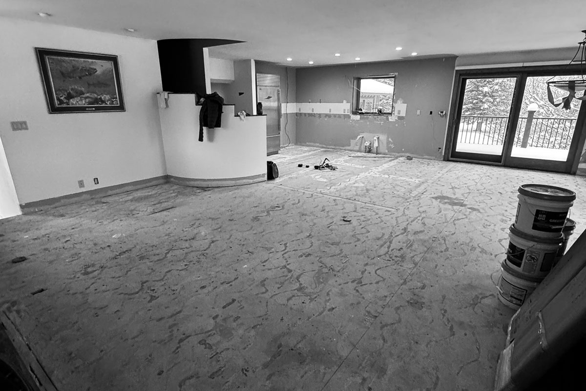 Fully removed flooring prepping for remodel