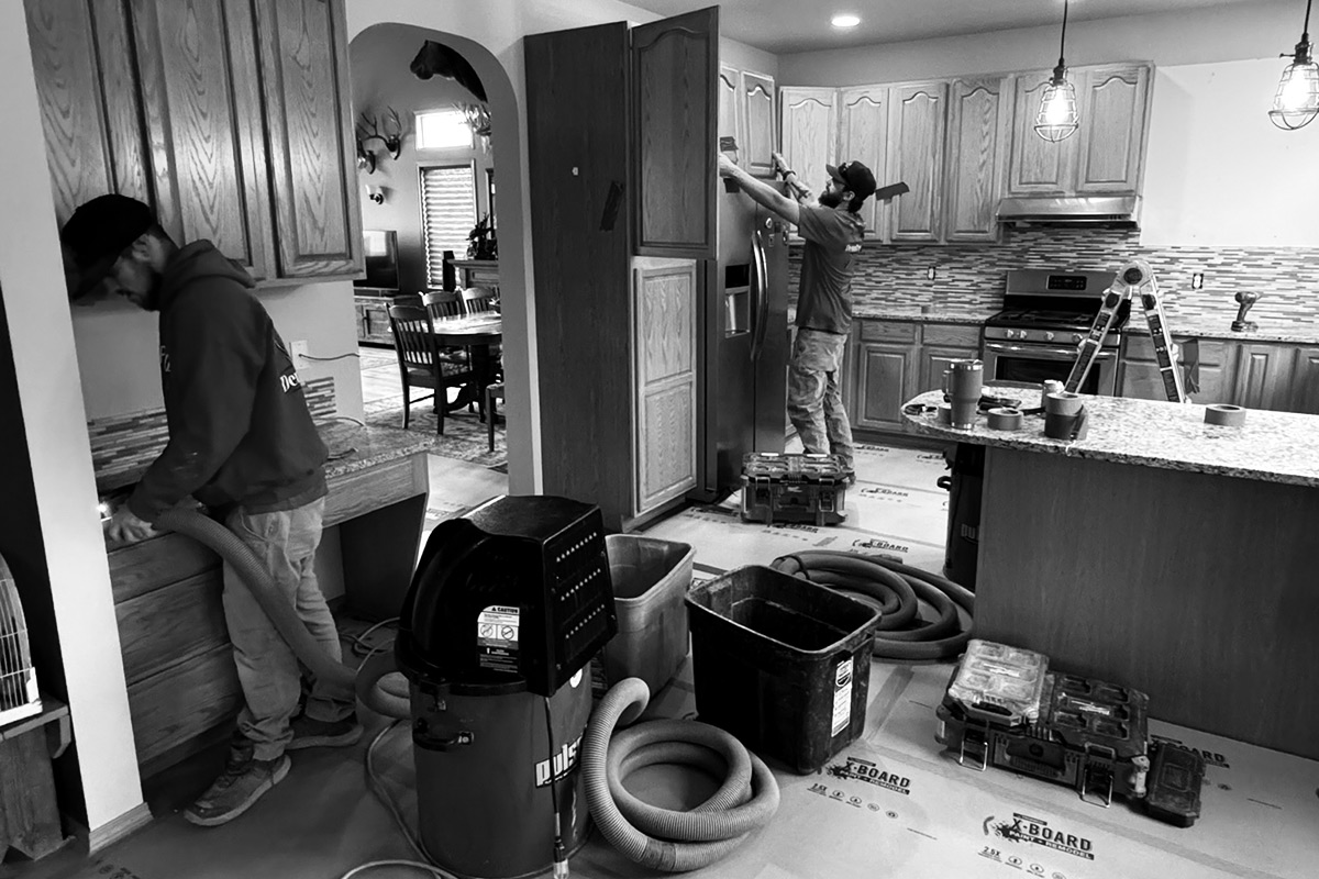 Demo Pros Team Demoing a Kitchen