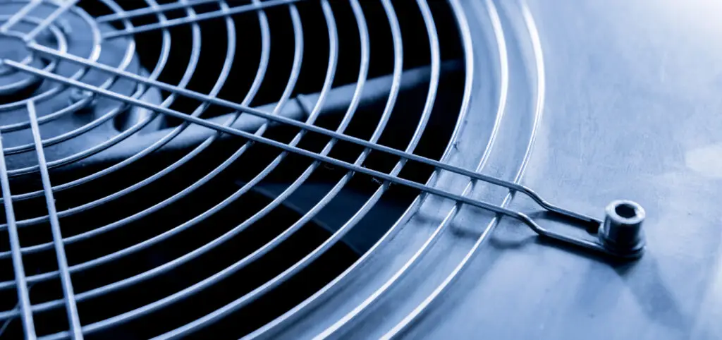 Close-up of a metal ventilation grille with a protective wire cover, ideal for dust-free demolition and safe air control.