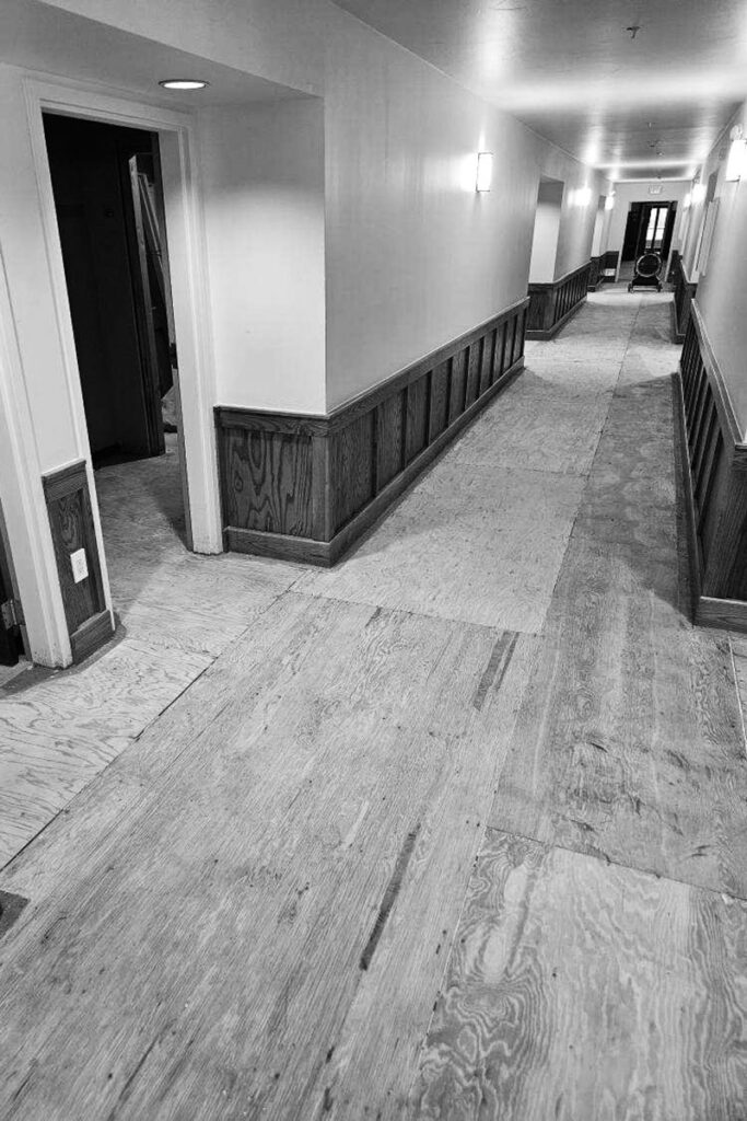 Flooring removal in a hotel hallway