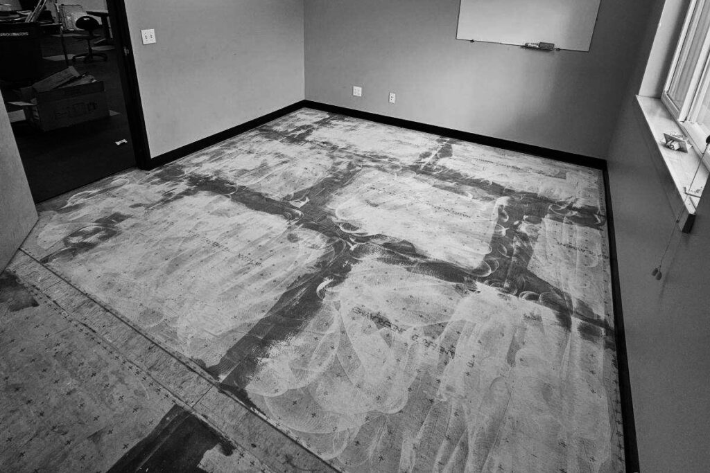 Removing old carpet and adhesive